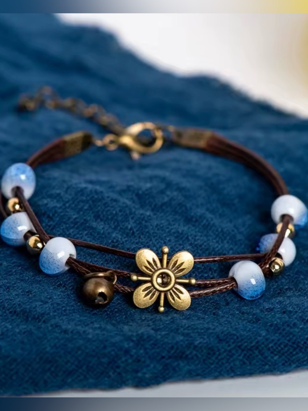 Anthropologie Gold Flower Charm Blue Bead Bracelet